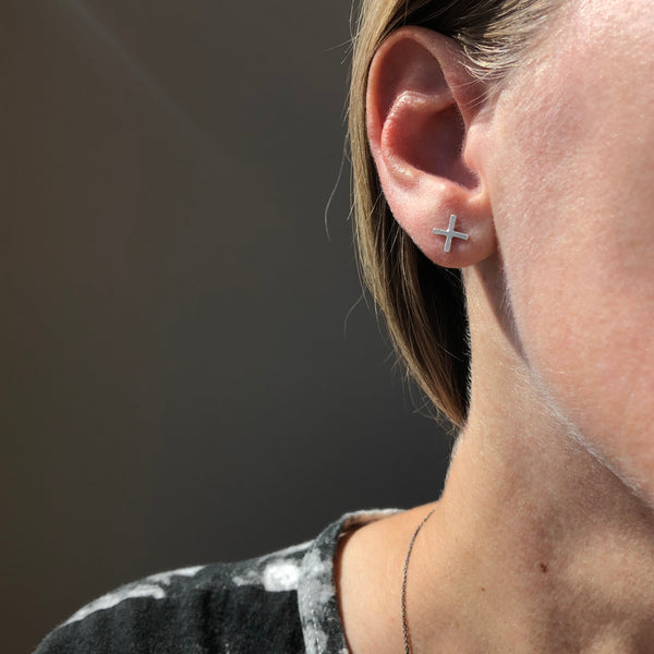 Positive stud earrings in sterling silver, medium