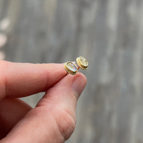 Small oval moonstone studs in 18k gold
