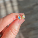 Small oval moonstone studs in 18k gold