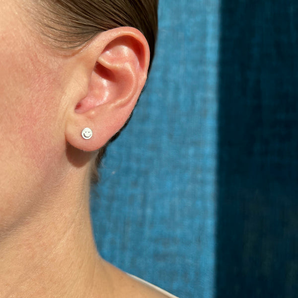 Silver smiley face stud earrings, single or pair