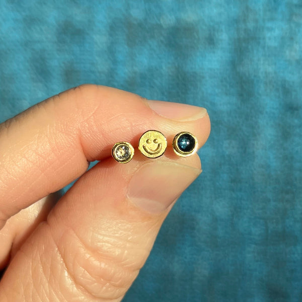Silver smiley face stud earrings, single or pair
